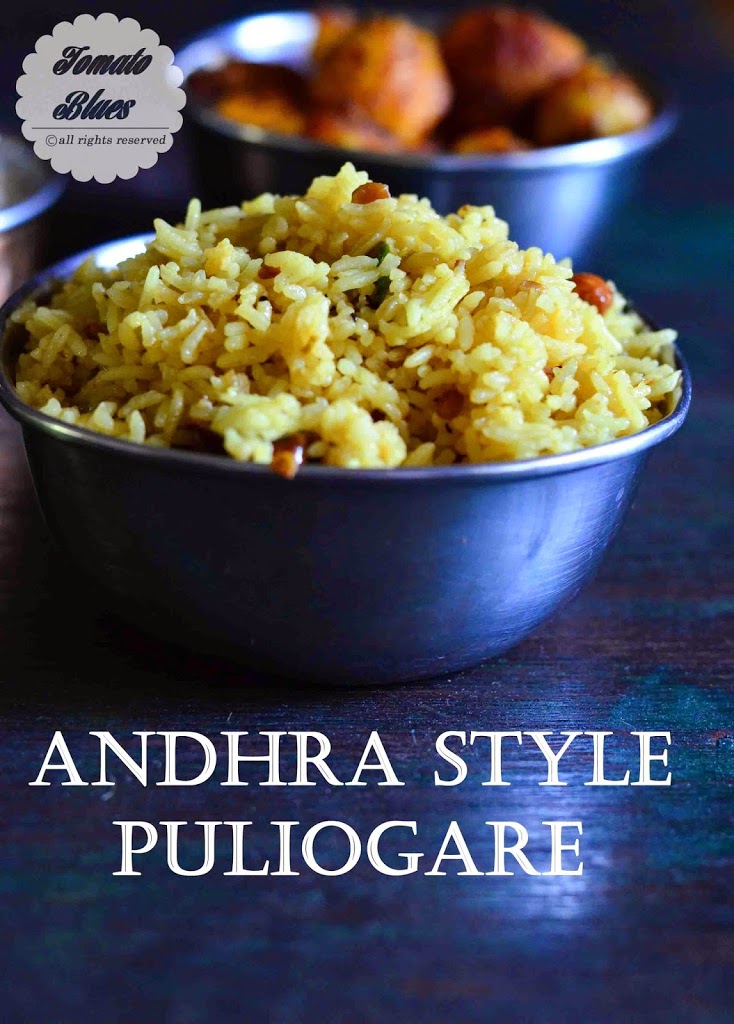 andhra puliohara served in a stainless steel bowl