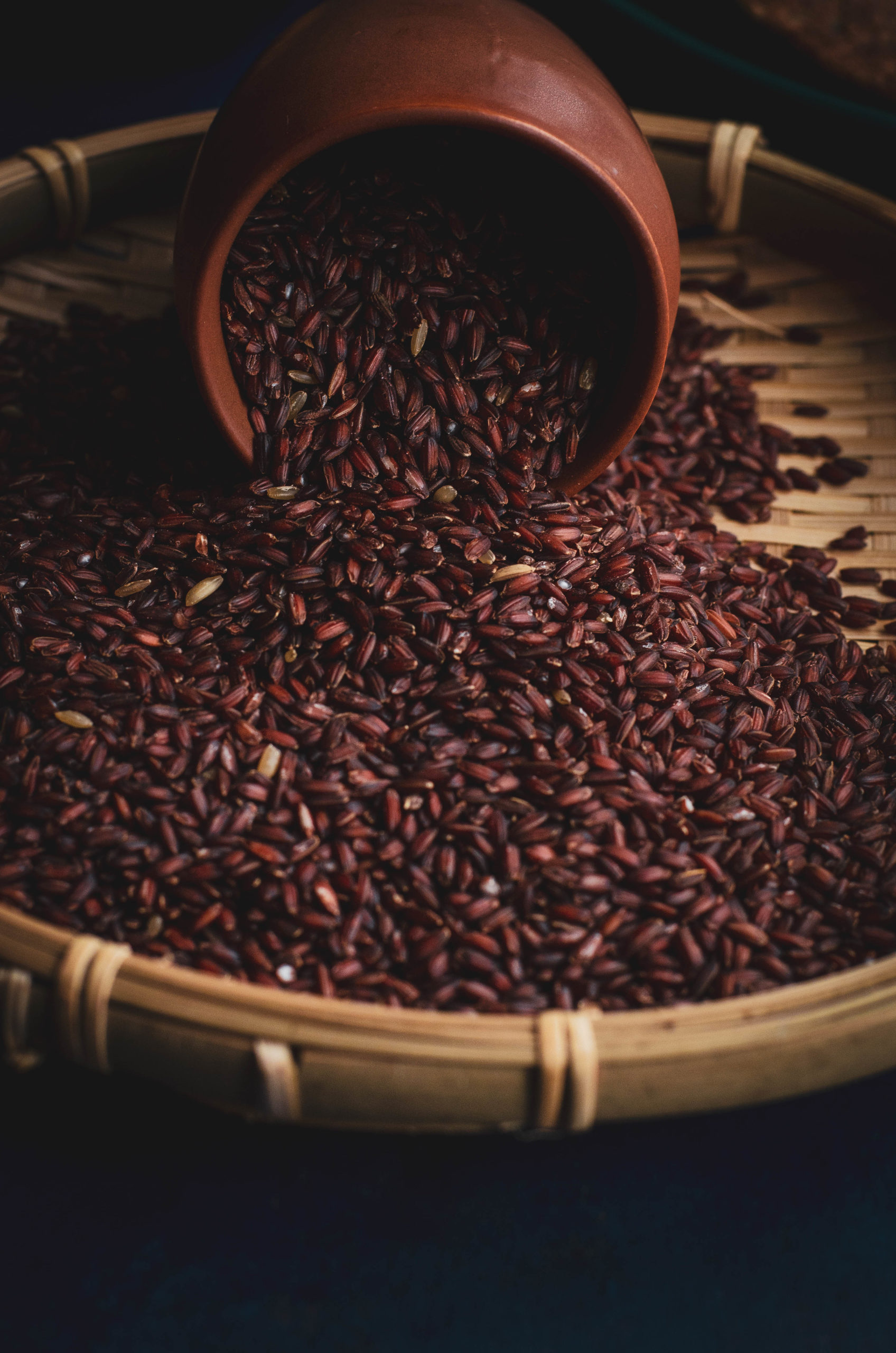 mapillai samba - native Indian rice scattered on a bamboo basket