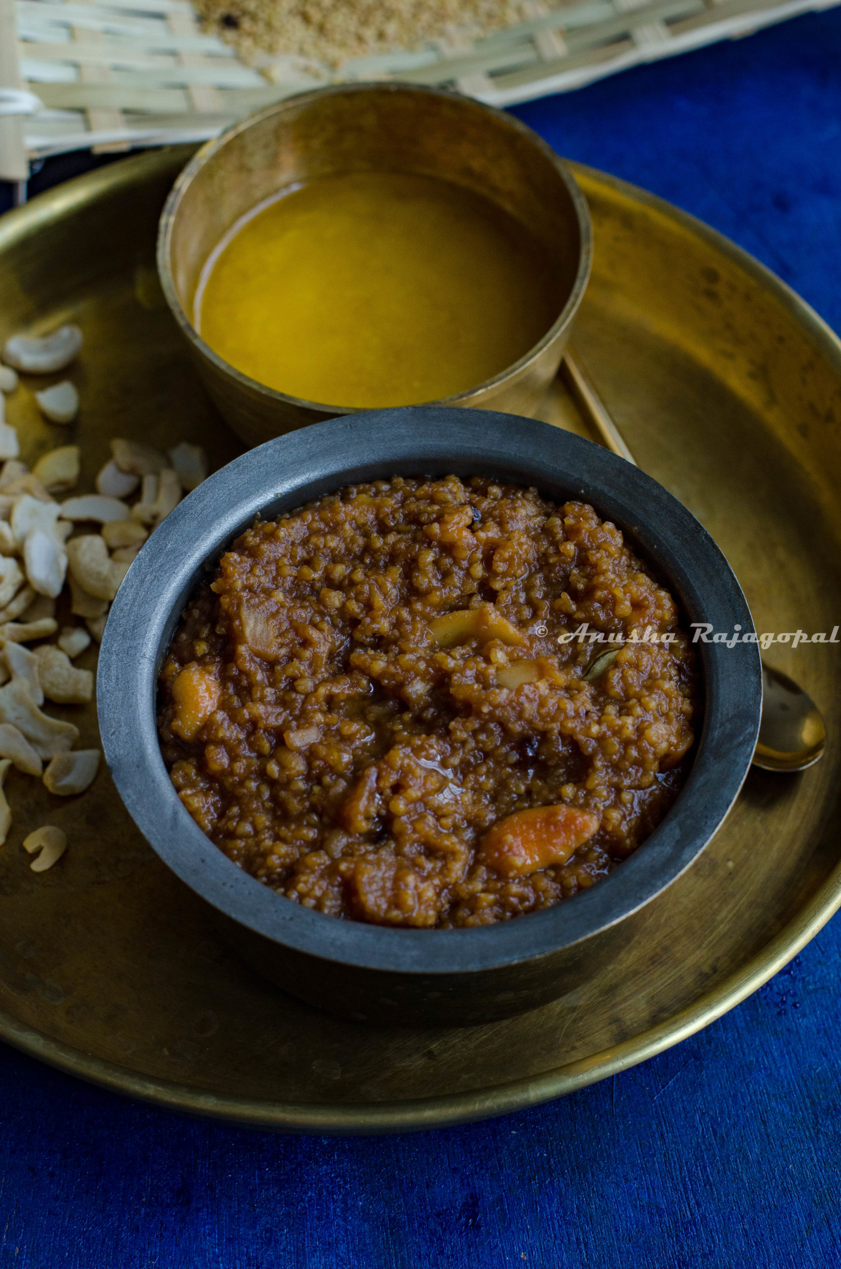 Thinai Sakkarai Pongal served in a brass bowl on a brass platter